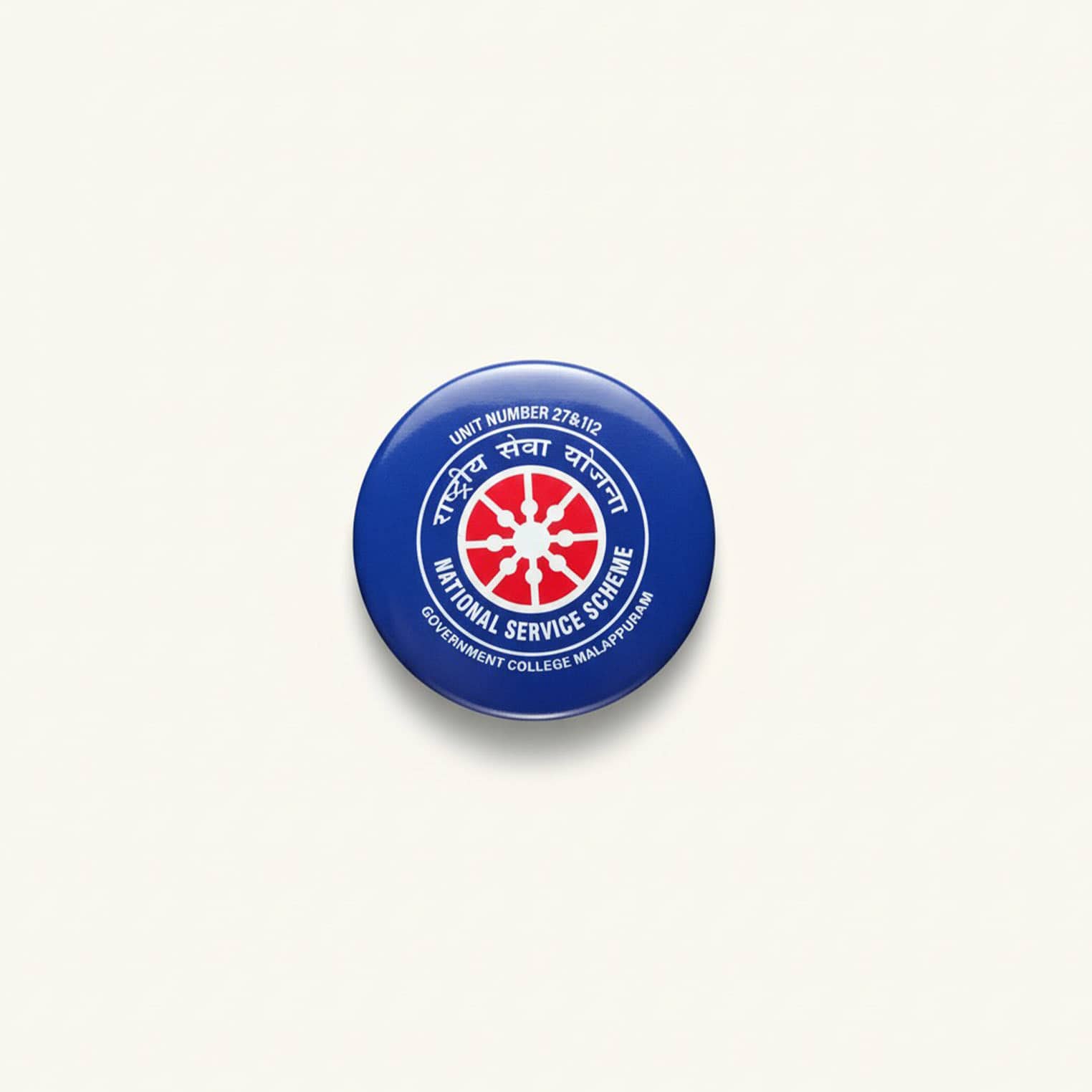Badge with National Service Scheme logo and text.