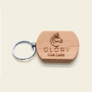 Engraved wooden keychain with logo for promotional branding.