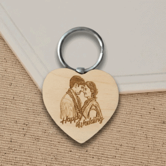 Engraved wooden keychain with a couple's portrait and "Happy Wedding" message. Perfect personalized.