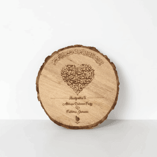 Engraved round wooden plaque with calligraphy and personalized message.